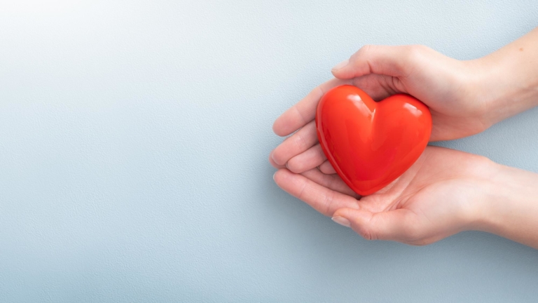 Hands holding a heart