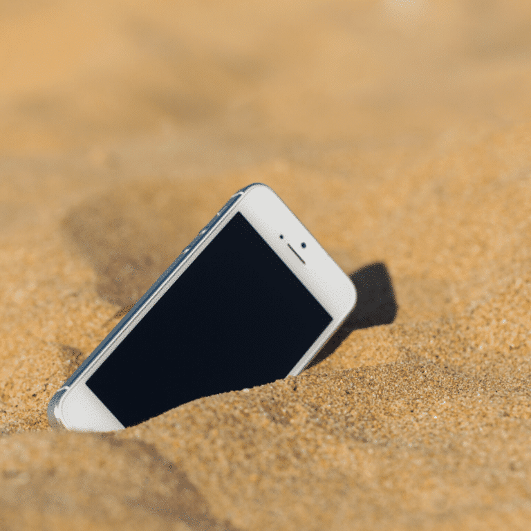 Phone buried in the sand