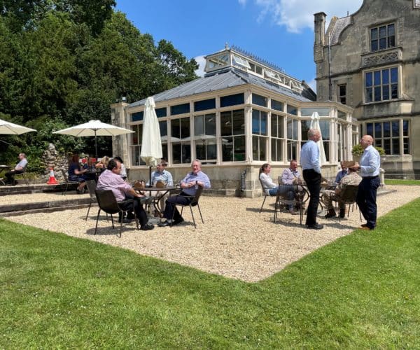 Members sit outside the Conservatory Cafe