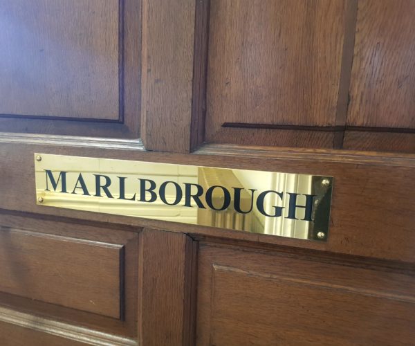 The Marlborough's Brass Door Sign
